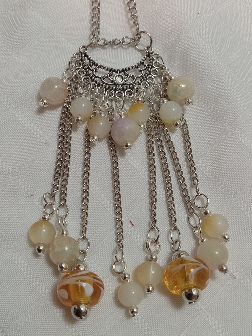 Exquisite handmade necklace featuring a half-moon-shaped Tibetan silver charm